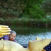 Jets&uuml;n Khandro Rinpoche with the Lotus Garden Buddha statue just before its installation on August 19 2010.