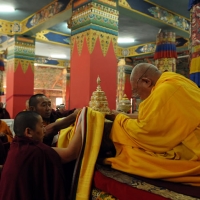 Mindrolling Jetsün Khandro Rinpoche making an offering to Kyabje Tsetrul Rinpoche during the Rinchen Terdzö empowerments at Mindrolling Monastery, 2008-2009