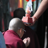Jetsün Khandro Rinpoche receives a torma blessing during the Rinchen Terdzö empowerments at Mindrolling Monastery, 2008-09