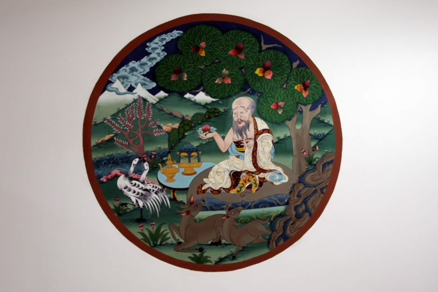 The airport entrance is decorated with an emblem of a mahasiddha.