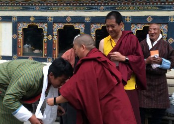 During a tea given by Lama Kunga la&#039;s family, khatags are offered to Jets&uuml;n Khandro Rinpoche while Kunga la and his father look on.