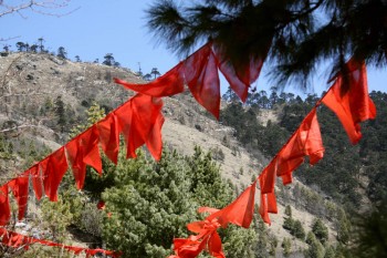 Prayer flags on Chödrak Cliff.