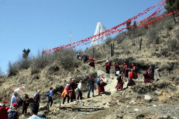 Jetsün Khandro Rinpoche leads the climb to Ch&ouml;drak Monastery built at the site of Longchenpa&#039;s retreat cave.