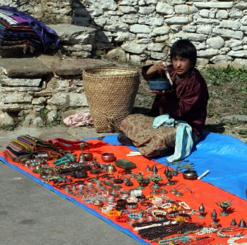 Local vendor displays his wares at the gates of Jampa'i Lhankang.