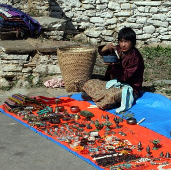 Local vendor displays his wares at the gates of Jampa&#039;i Lhankang.