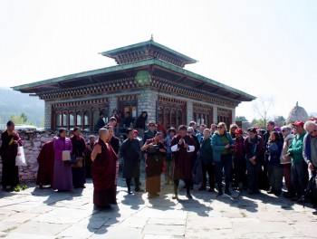 Jets&uuml;n Khandro Rinpoche looks on as the tour coordinator, Tenpa Choephel la expains the history of the region.