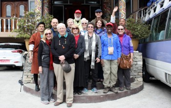 The passengers of bus number 4 gather for a photo.