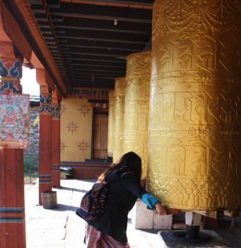 Turning a prayer wheel at the Memorial Chorten.