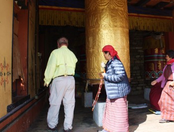 Turning the prayer wheel at the Memorial Choten in Thimphu.